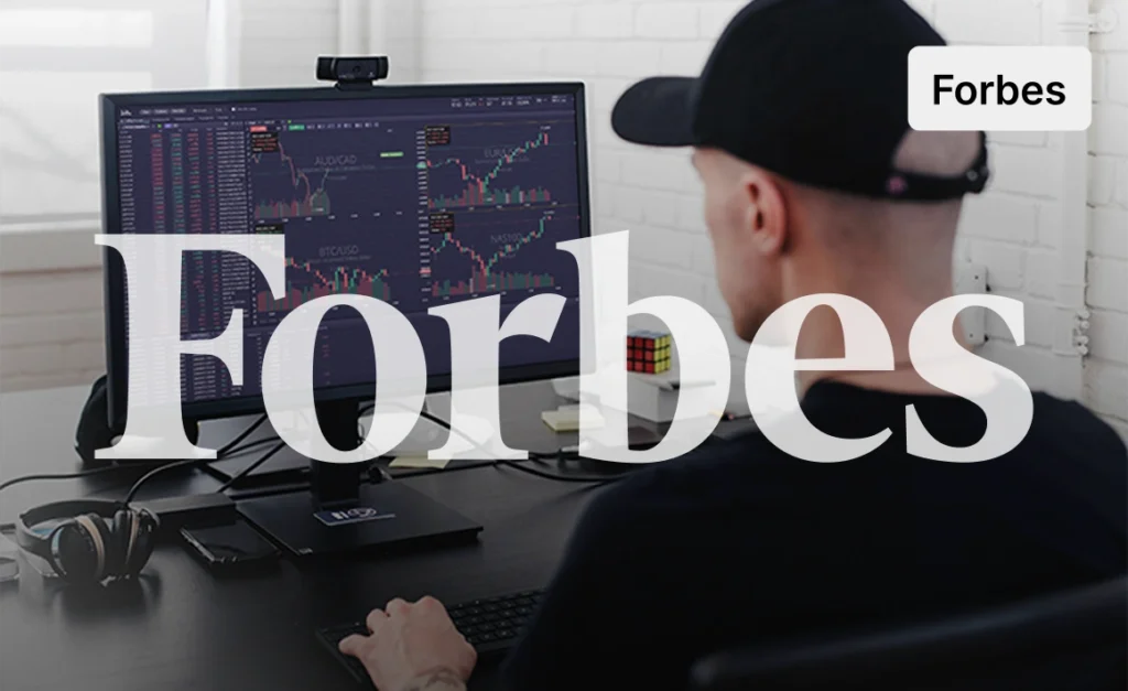 Day trader on trading platform with charts, TradingView, forex trading pairs, trading journal, Rubik's cube, headphones, and funded account.