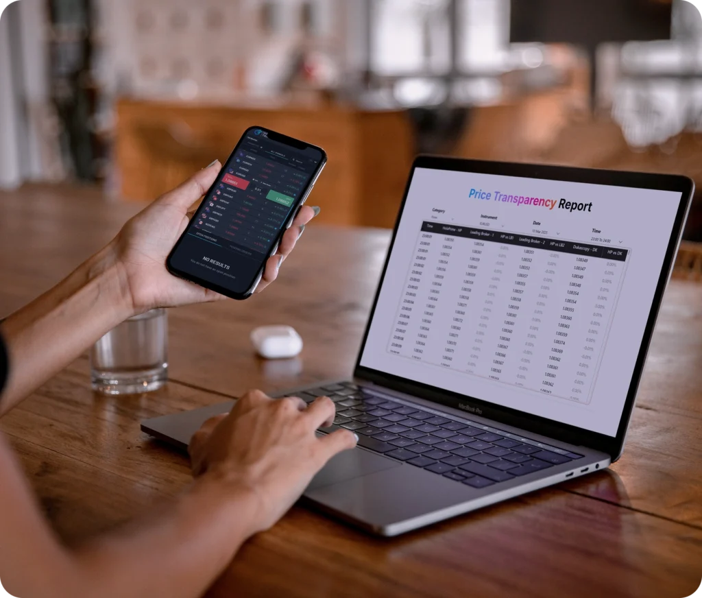 Person using a laptop with a price report and holding a phone showing a trading app.